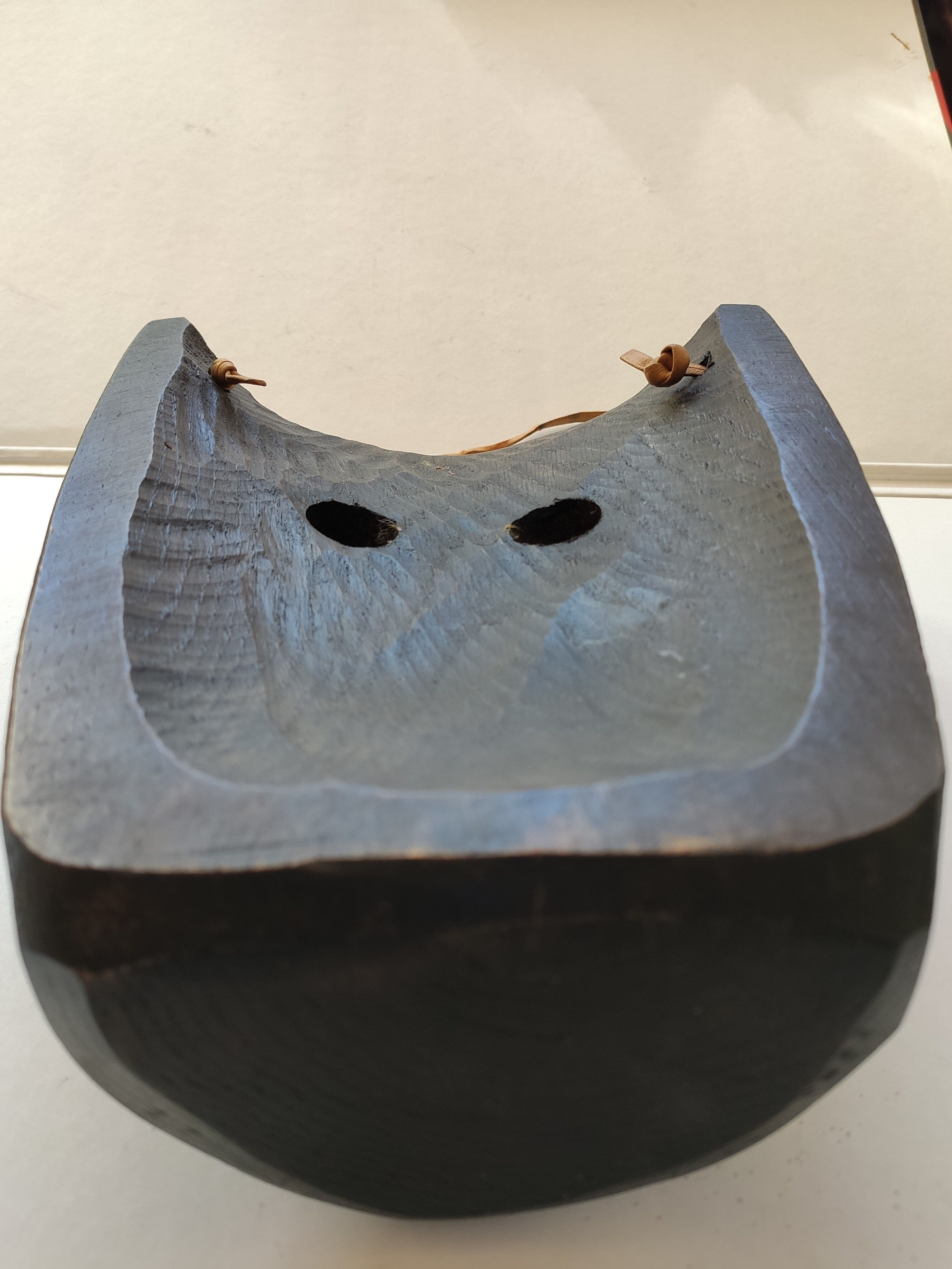Ethnic ebony wood mask for display or hanging.