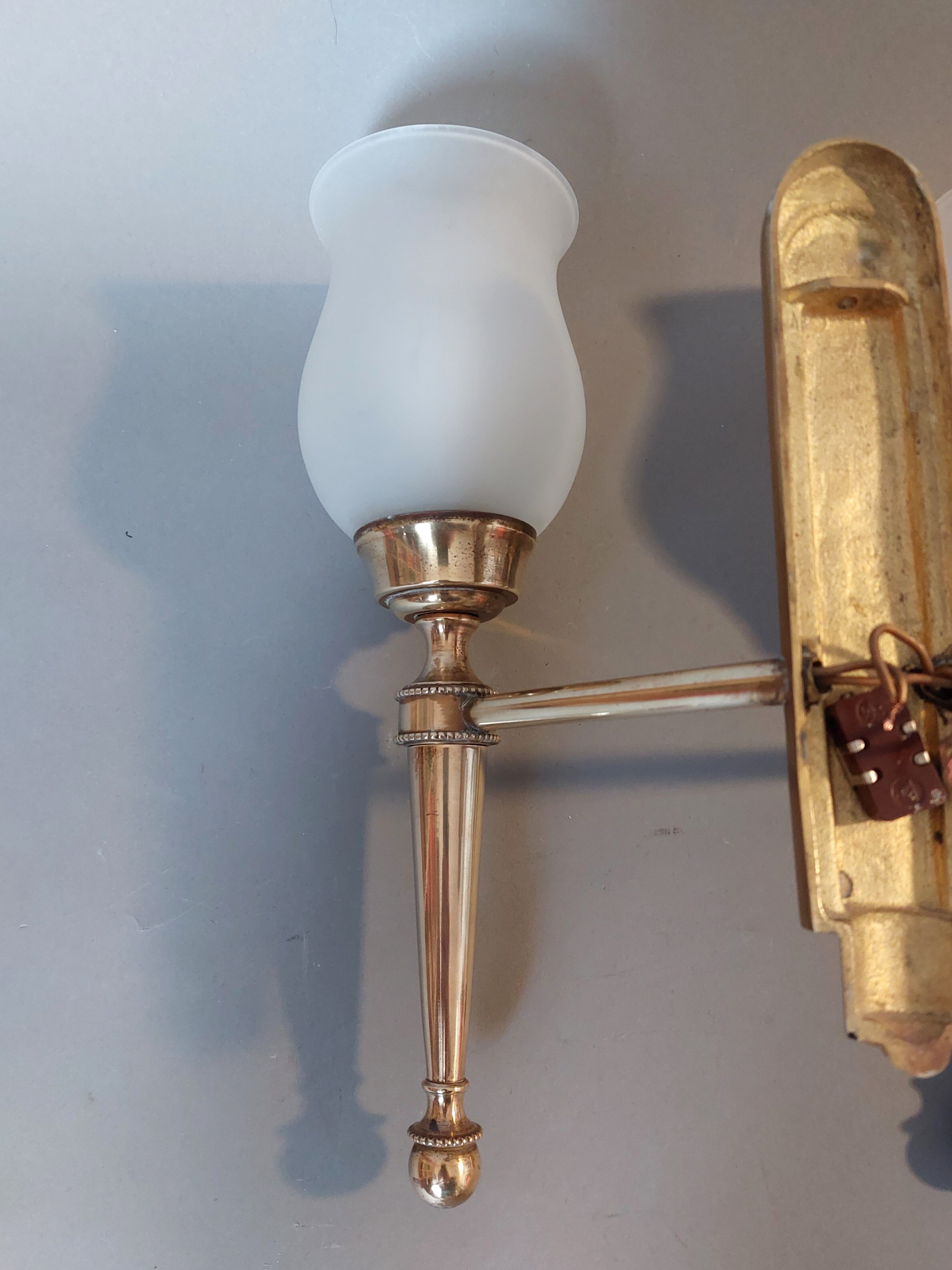 Neoclassical Torch two-arm wall lamp in solid brass, circa 1940