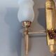 Neoclassical Torch two-arm wall lamp in solid brass, circa 1940