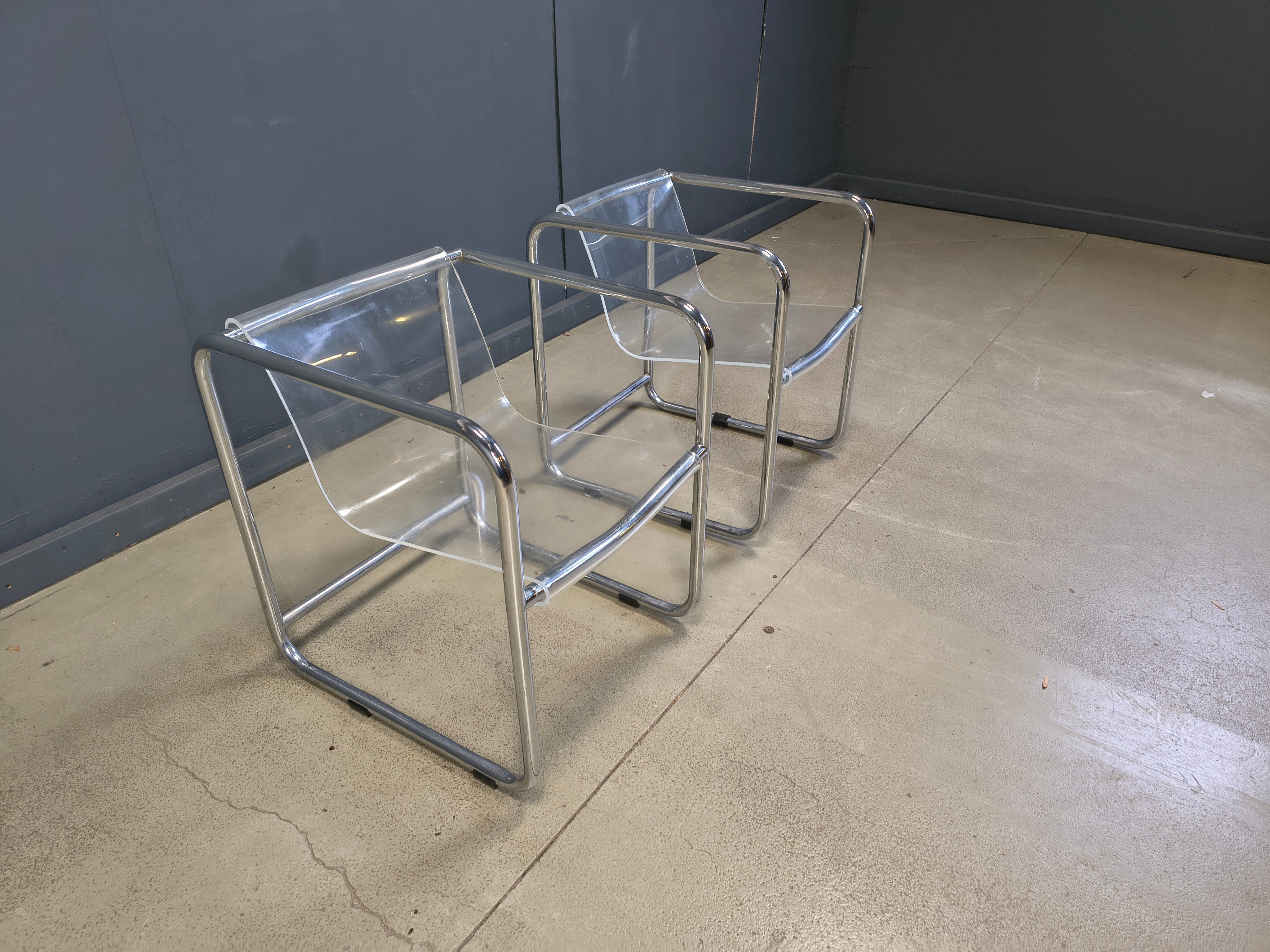 Pair of plexiglass and tubular chrome armchairs, 1970s