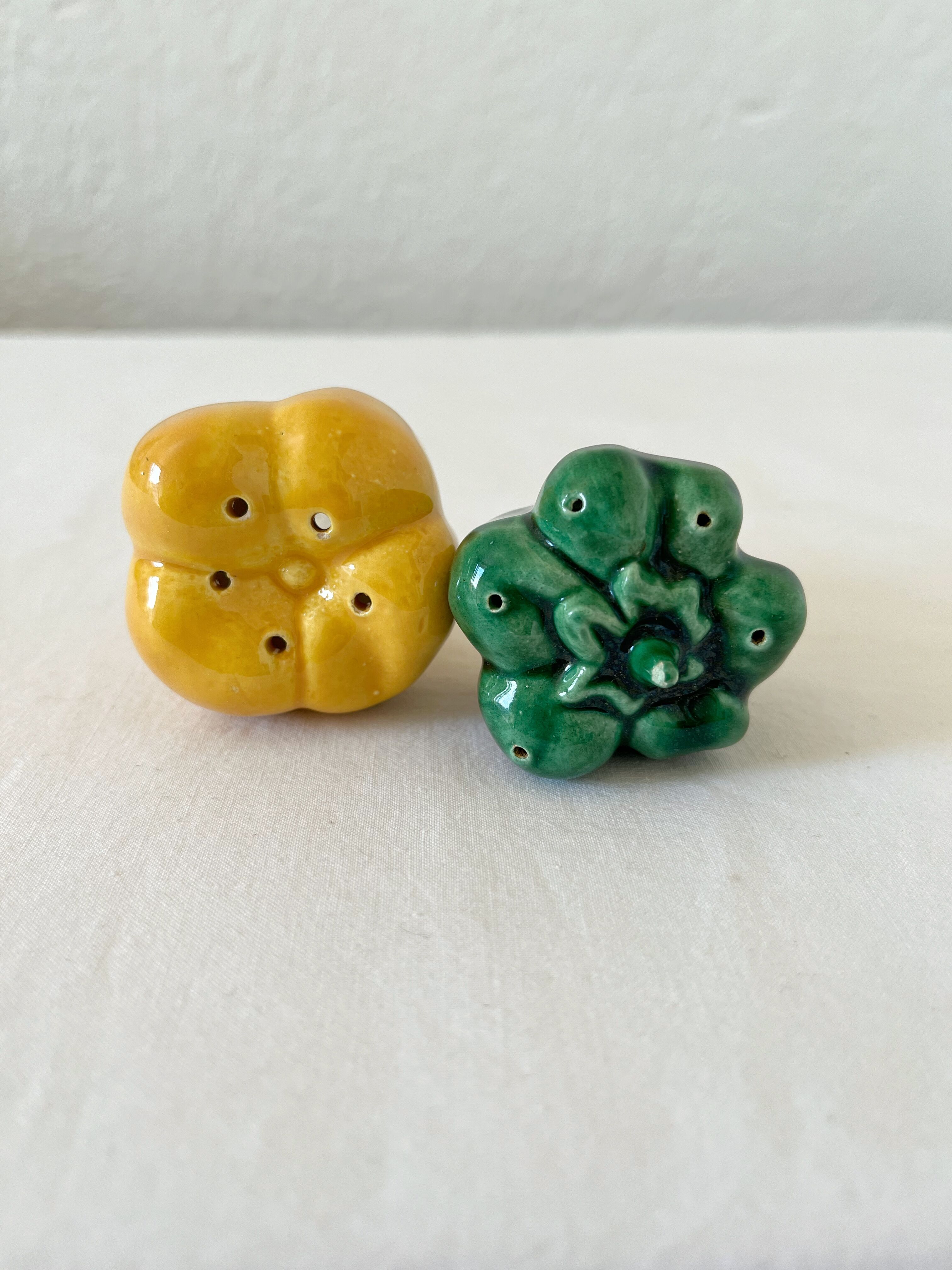 Salt shaker and pepper shaker in vintage slip