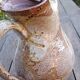 Old cider pitcher in varnished sandstone early 20th century