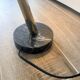 Eichholtz Cordero desk lamp in brass, black metal and marble.