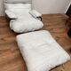 Armchair and ottoman Marsala in white leather by Michel Ducaroy for Ligne Roset
