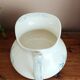 Old bulbous jug in ironstone earthenware