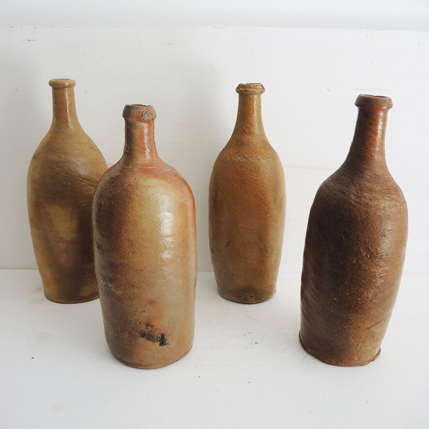 4 old stoneware bottles