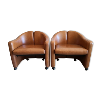 Pair of leather armchairs by Eugenio Gerli