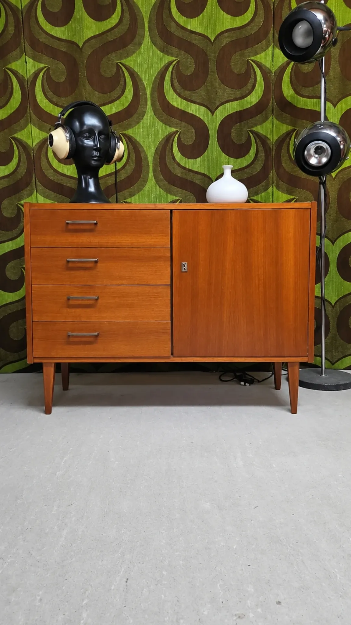 Small vintage sideboard from the 1960s with 4 drawers and a door.