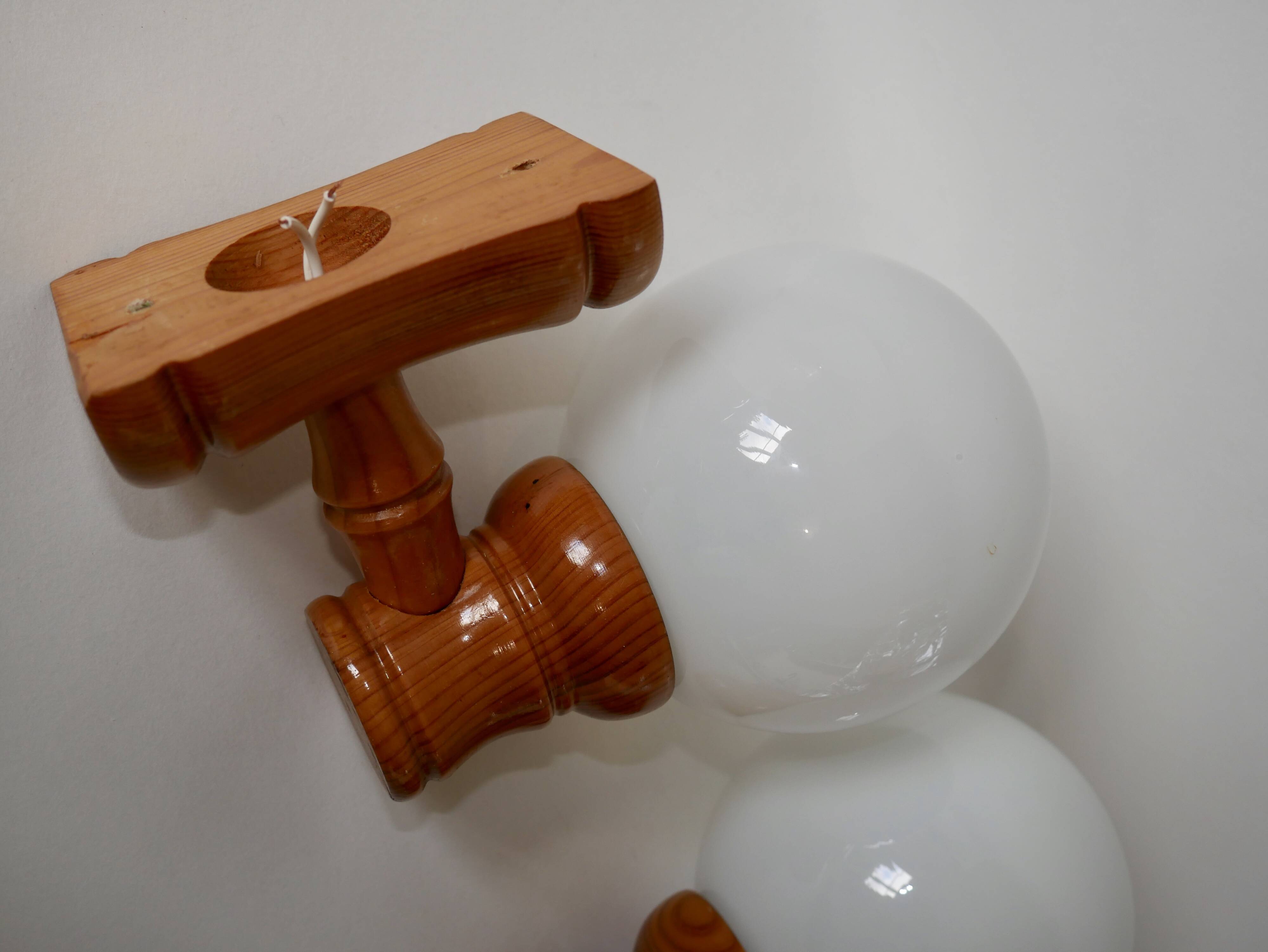 Pair of globe wall lights in pine and opaline from the 60s