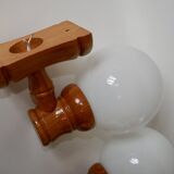 Pair of globe wall lights in pine and opaline from the 60s