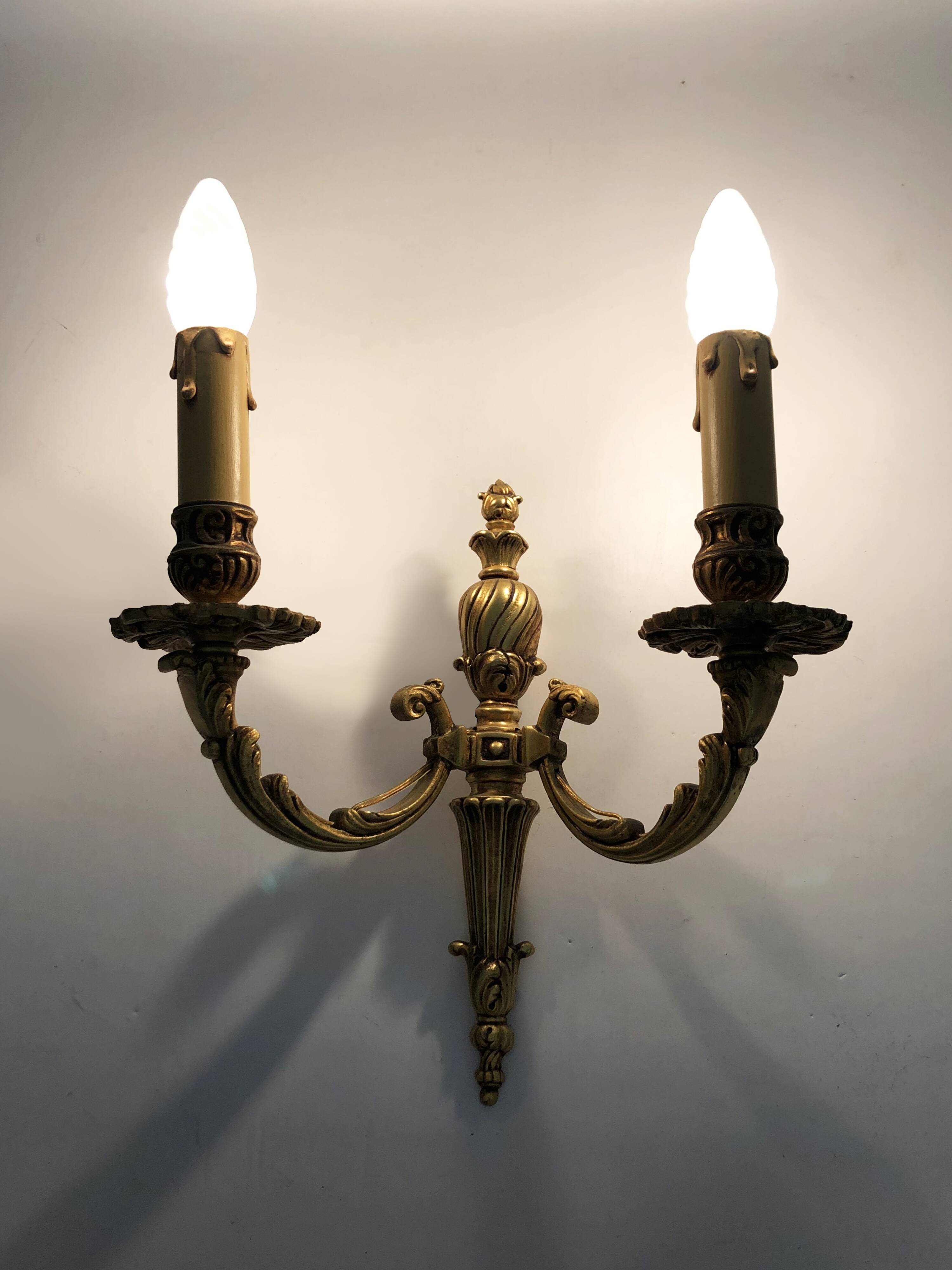Old pair of bronze double-light wall sconces. 60s