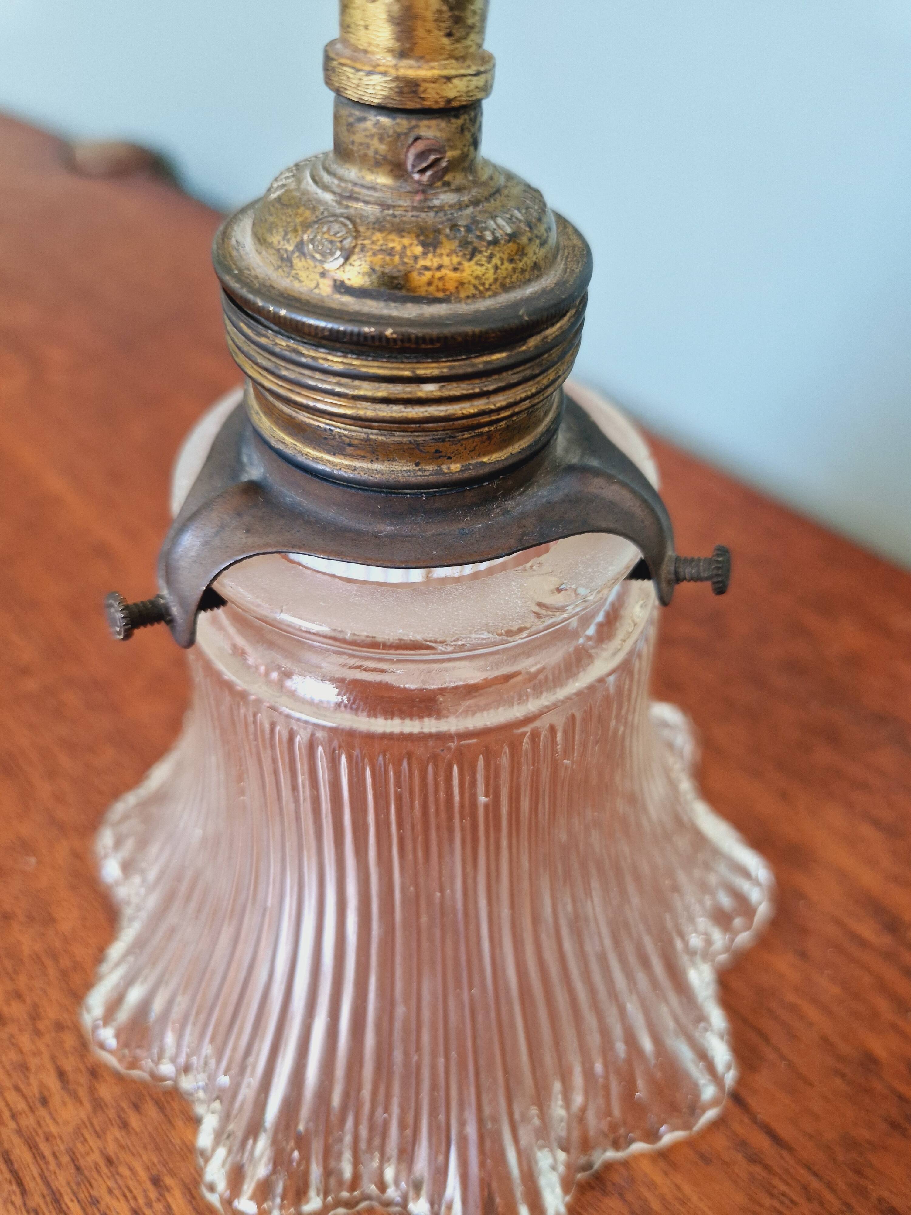 Bronze wall light with grooved clear glass, early 20th century