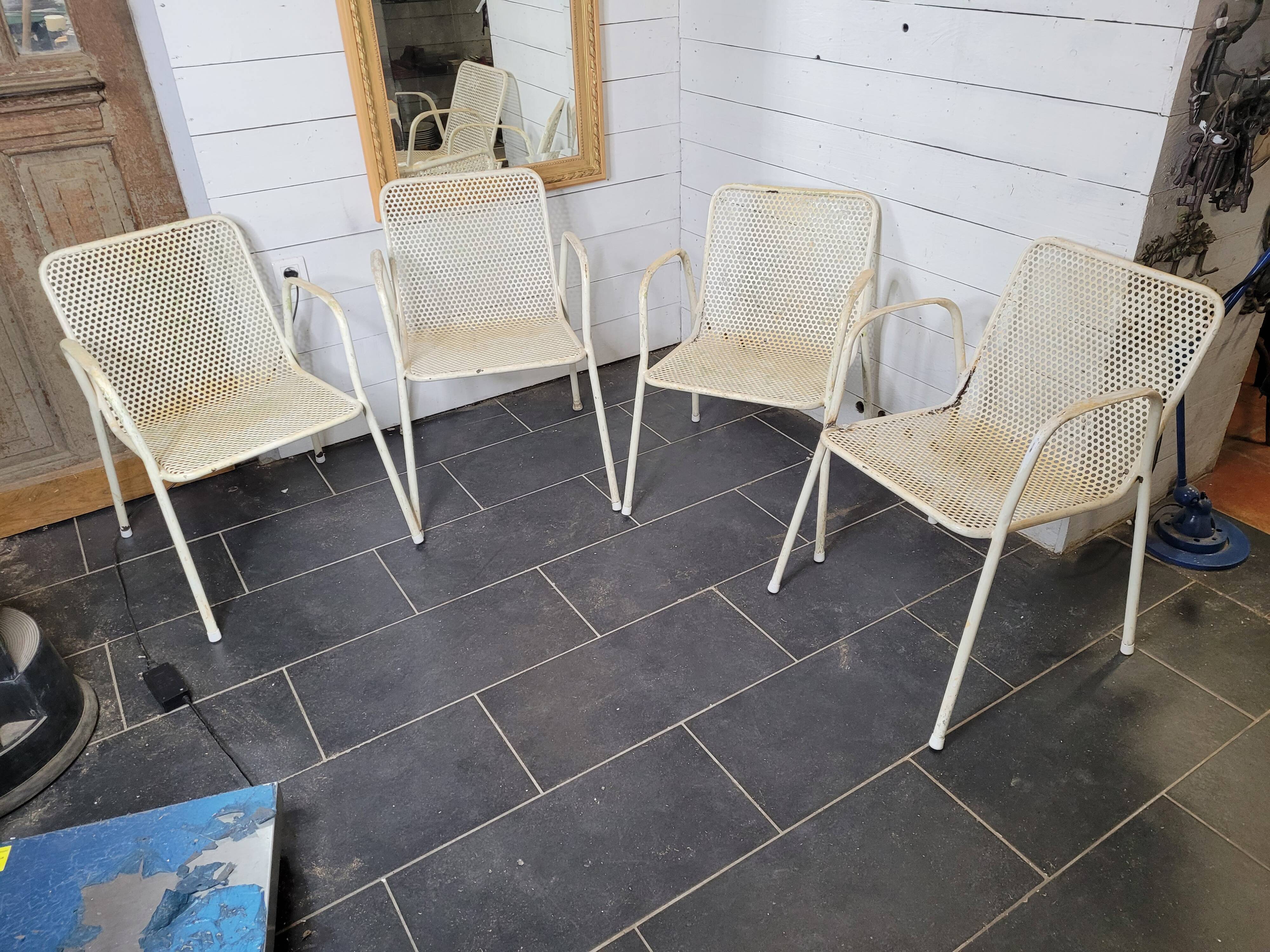 4 perforated metal garden armchairs