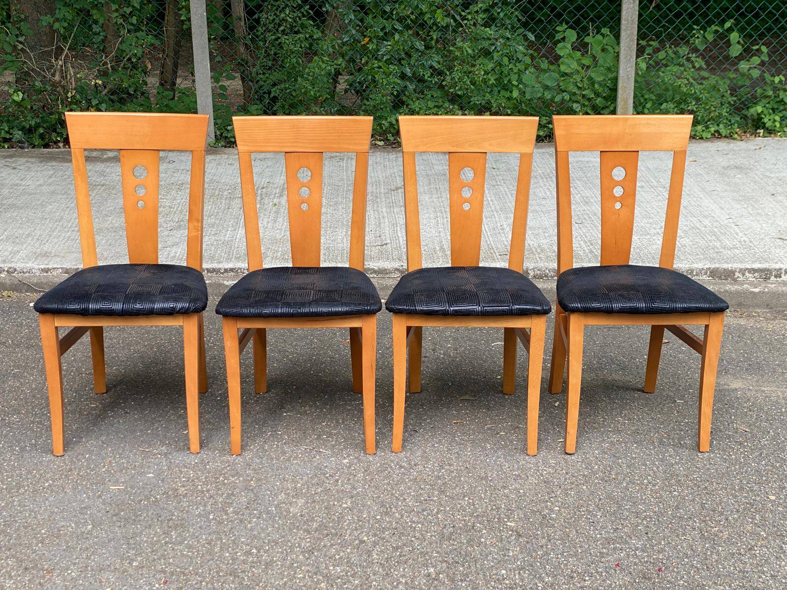 4 Scandinavian dining chairs in solid wood and black fabric from the 1990s.