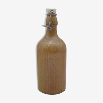 Small wooden sandstone bottle