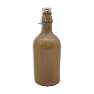 Small wooden sandstone bottle