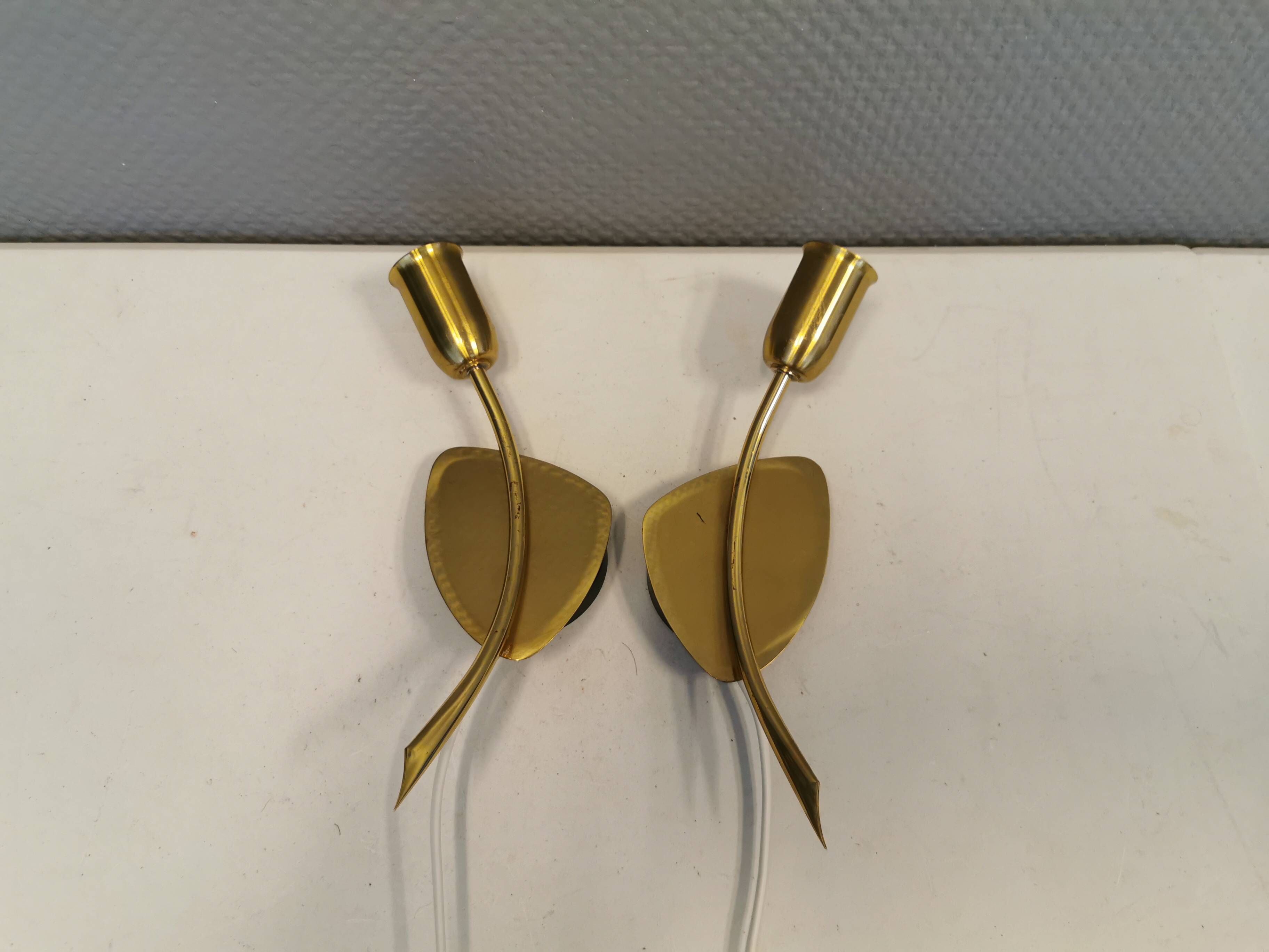 A set of "tulip" wall lamps in golden colored metal. Danish 1970-80s