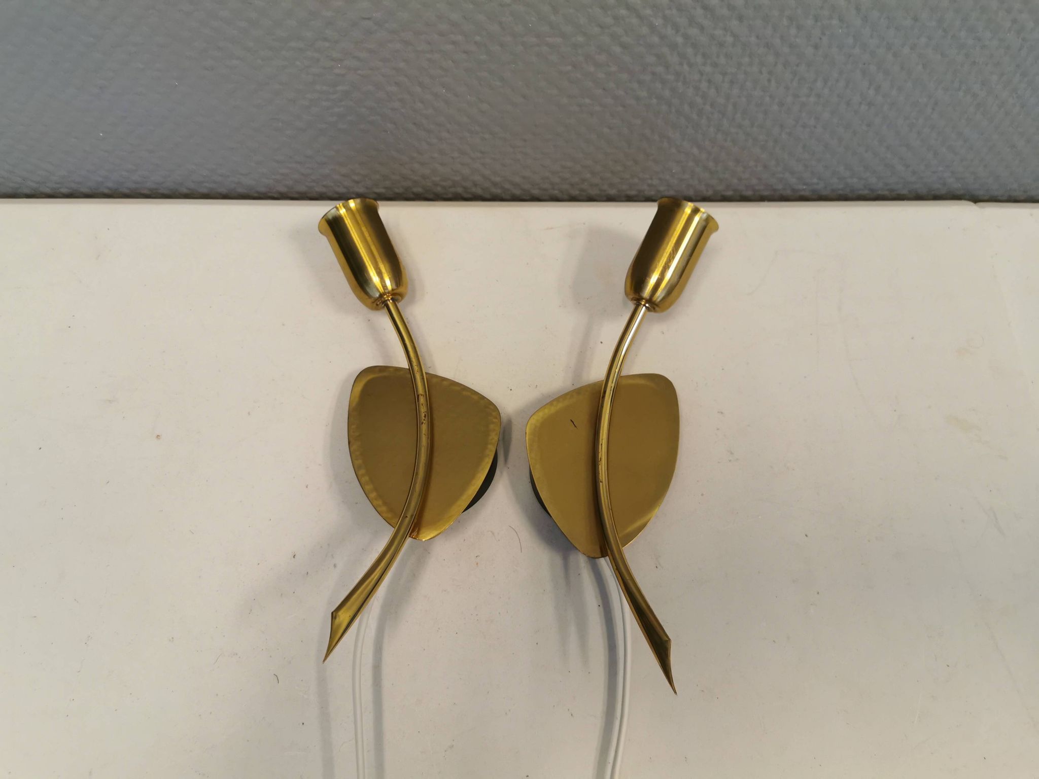 A set of "tulip" wall lamps in golden colored metal. Danish 1970-80s