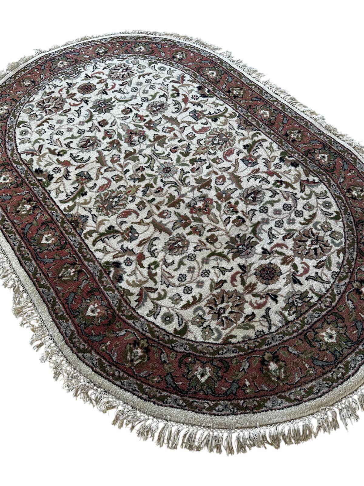 Handmade oval Persian rug 185cm x 120cm
