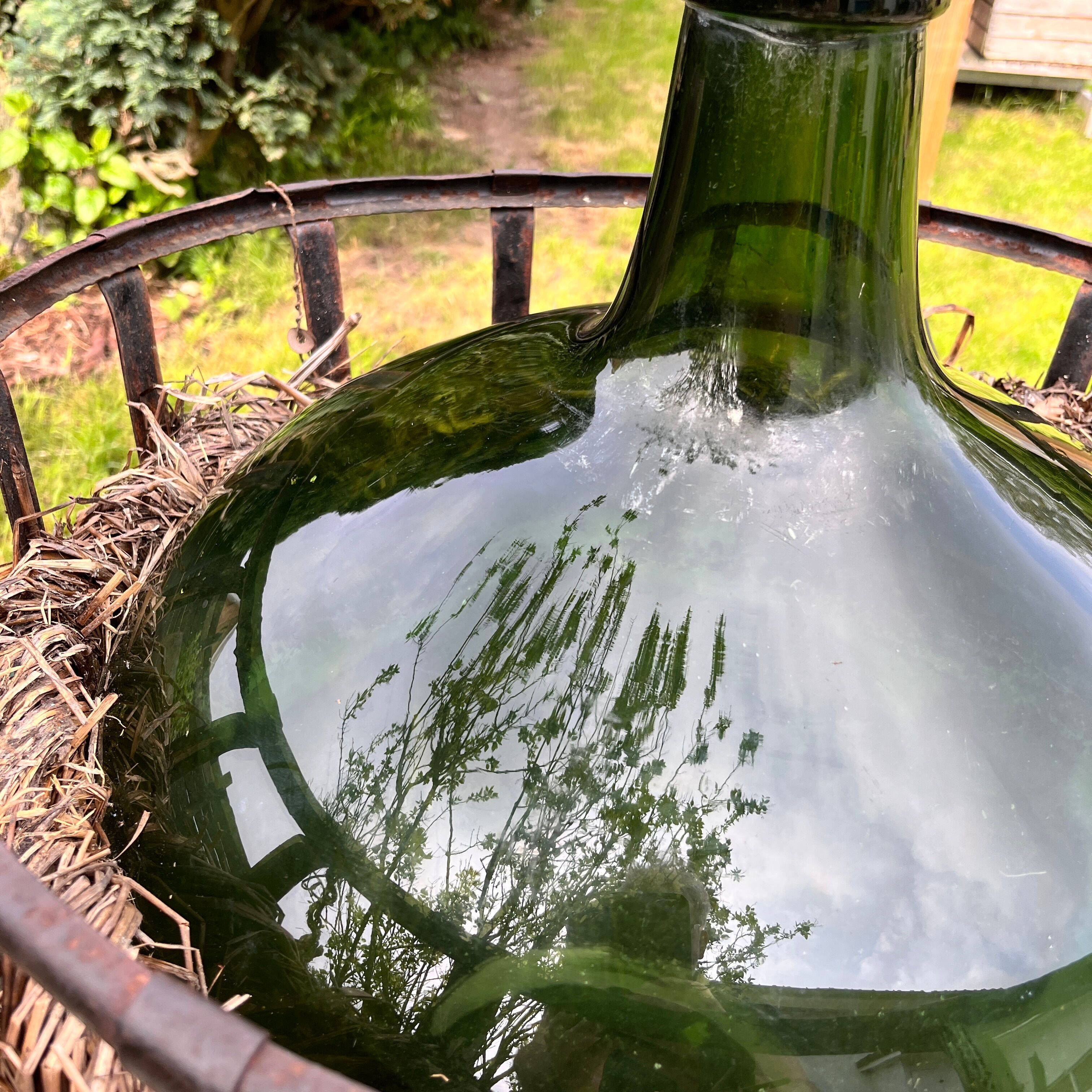Demijohn on steel rocker
