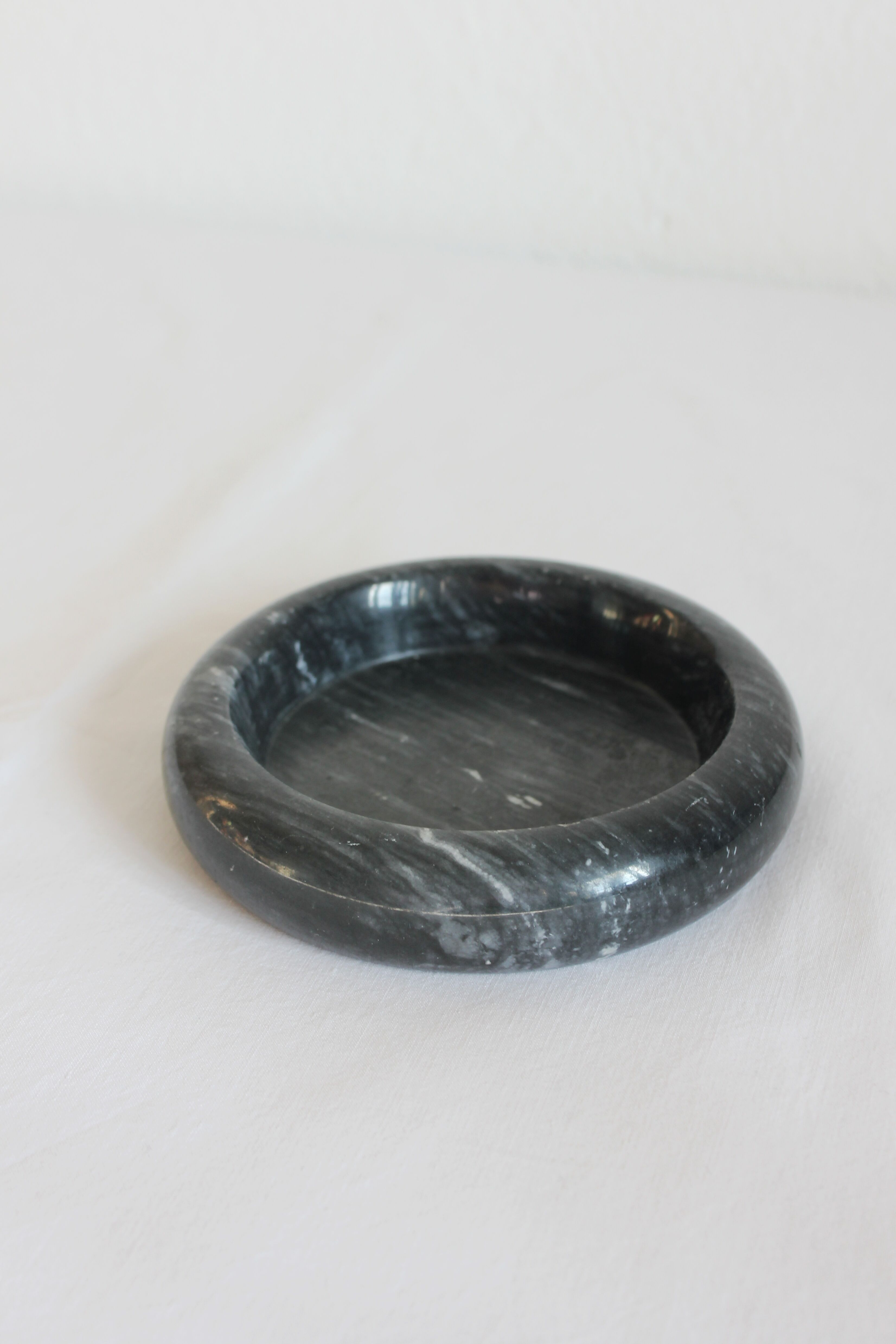 Ashtray or empty black marble pocket