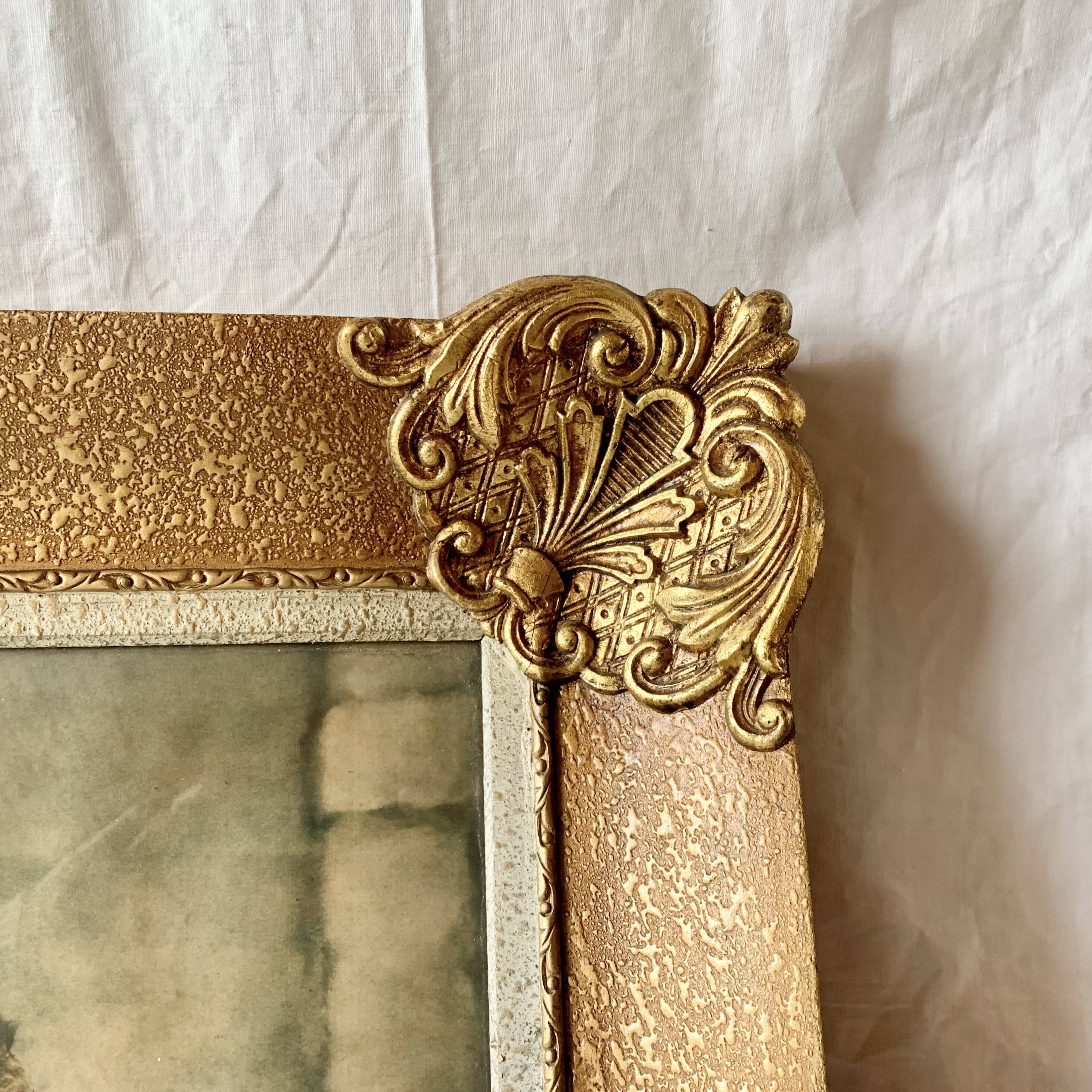 Old wall frame in carved gilded wood