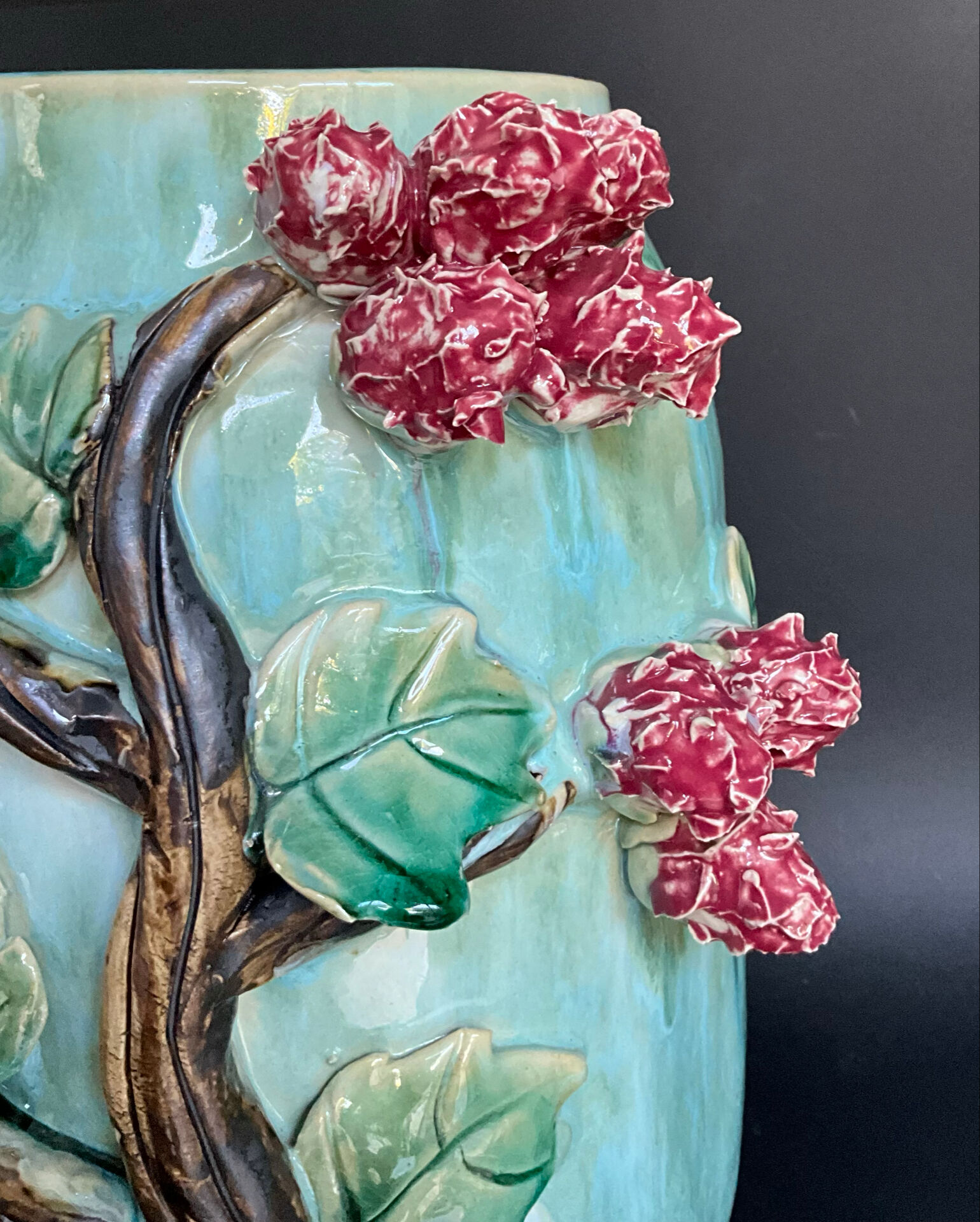 Large turquoise ceramic vase Athezza with raised floral decoration.