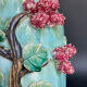 Large turquoise ceramic vase Athezza with raised floral decoration.