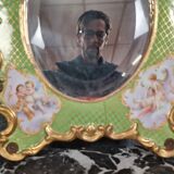 Porcelain mirror with cherub decorations circa 1900