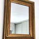 Antique mirror in gilded and copper wood