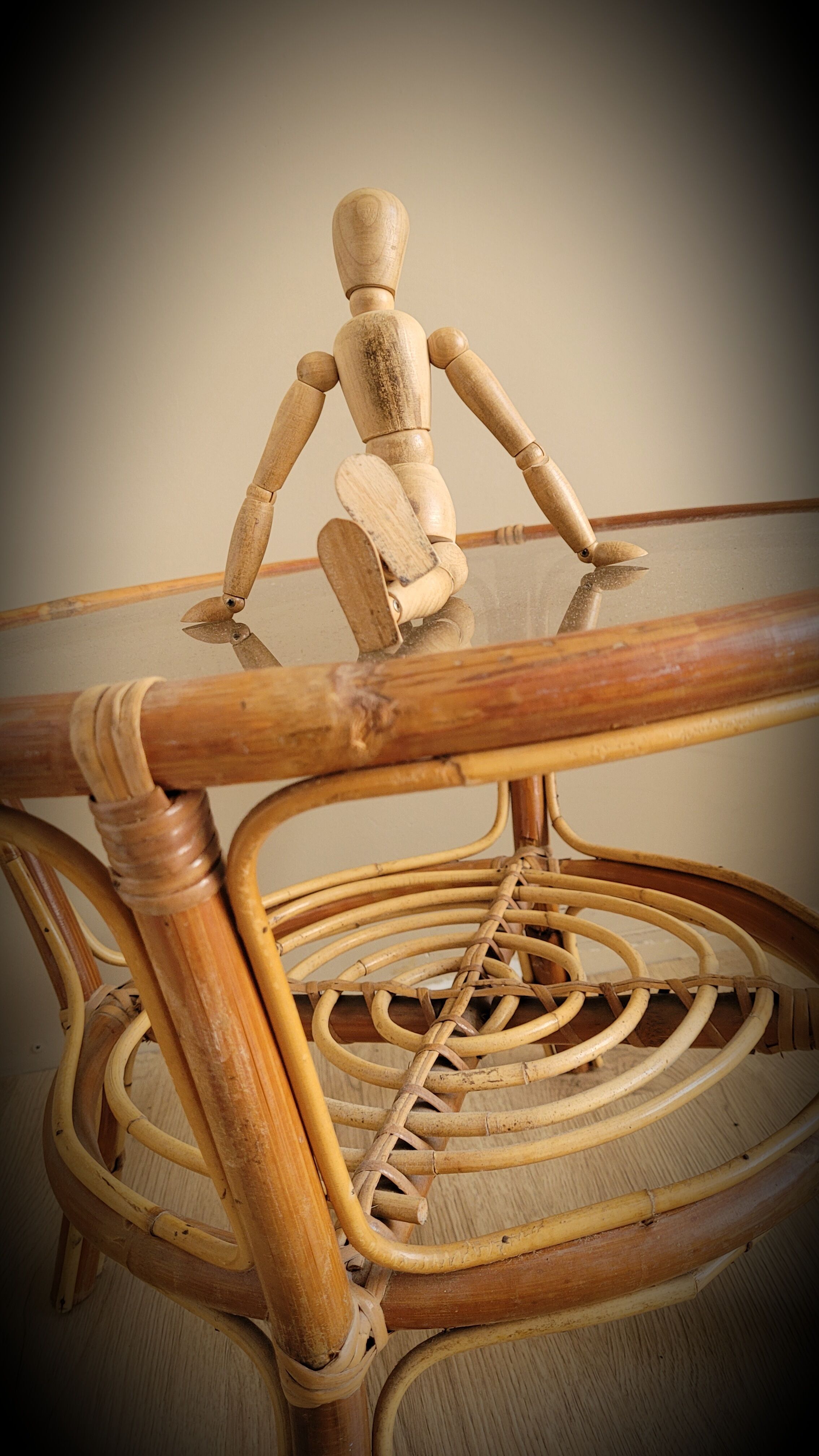 Light rattan lounge table and smoked glass