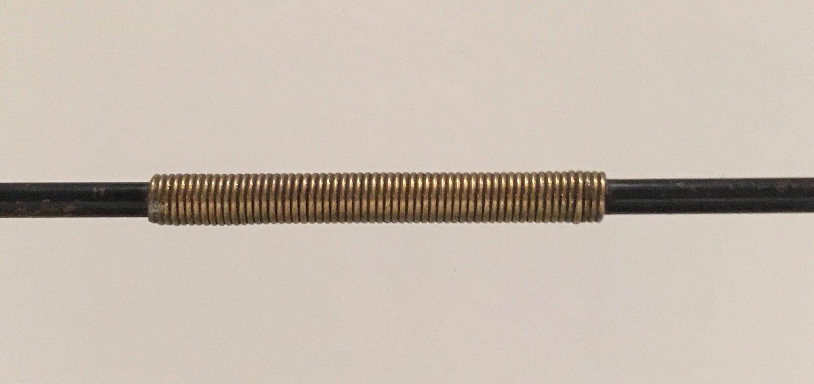 Black lacquered metal design magazine rack, perforated sheet and brass