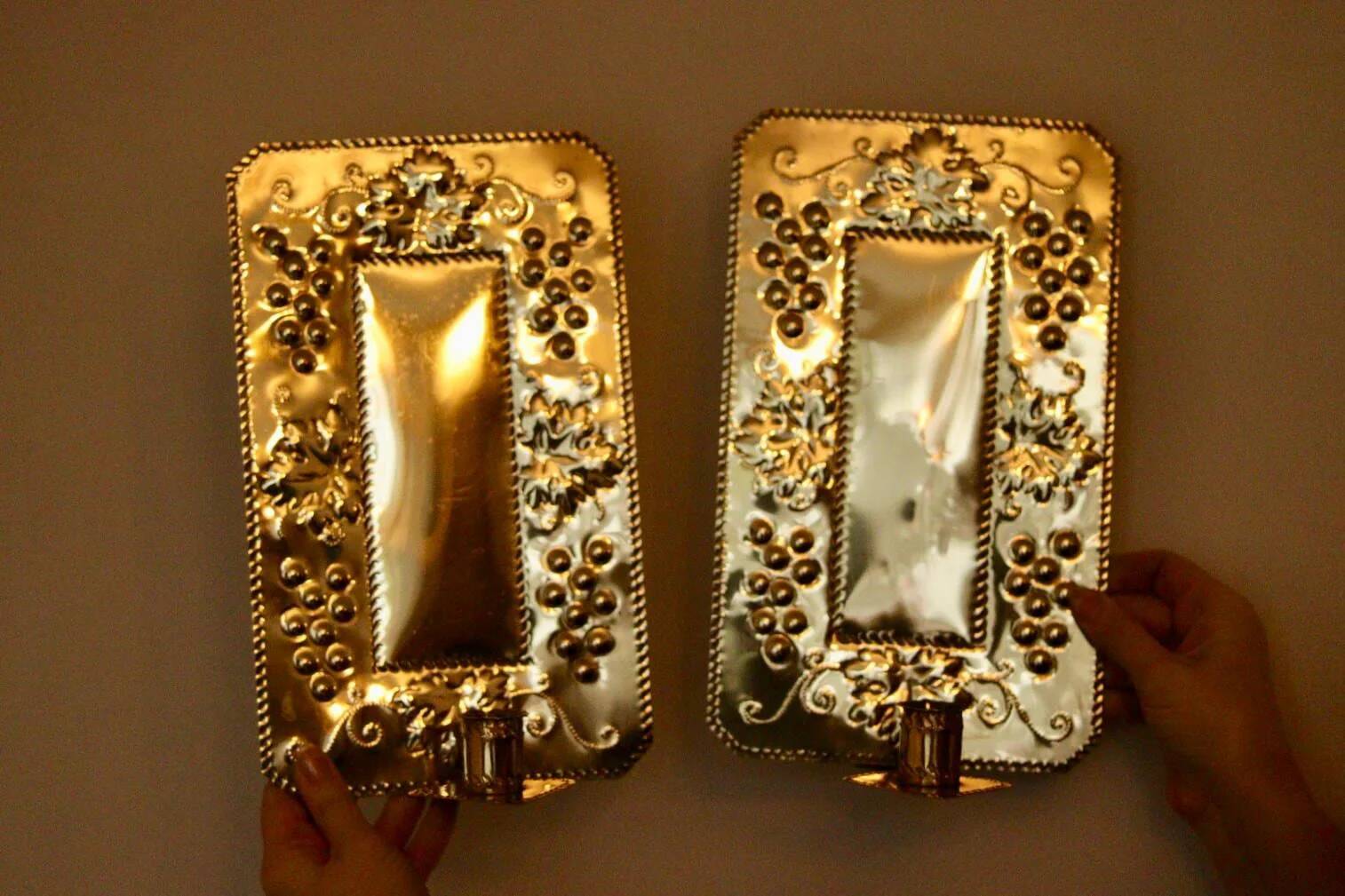 A pair of Swedish brass wall sconces from the mid-century.