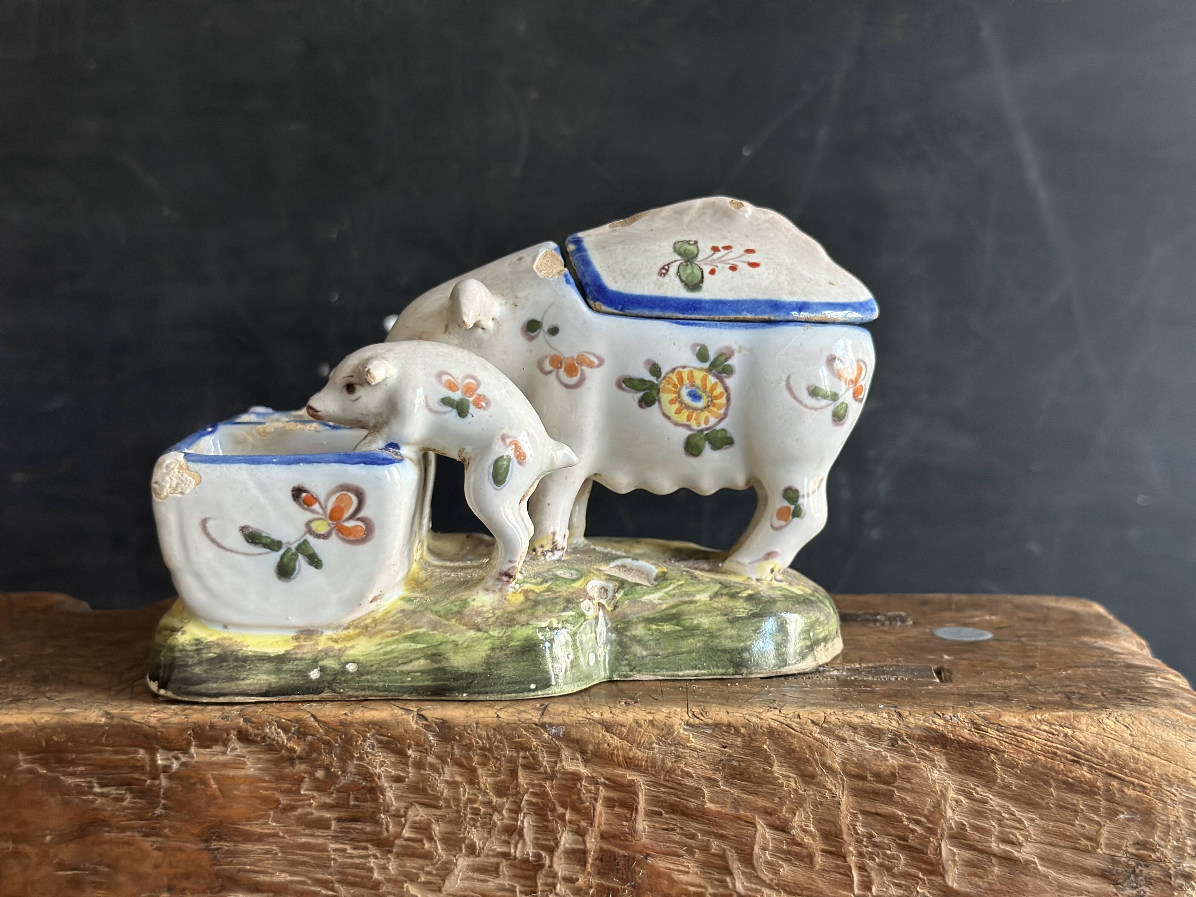 Antique earthenware pig box, salt cellar or mustard pot, floral decoration.