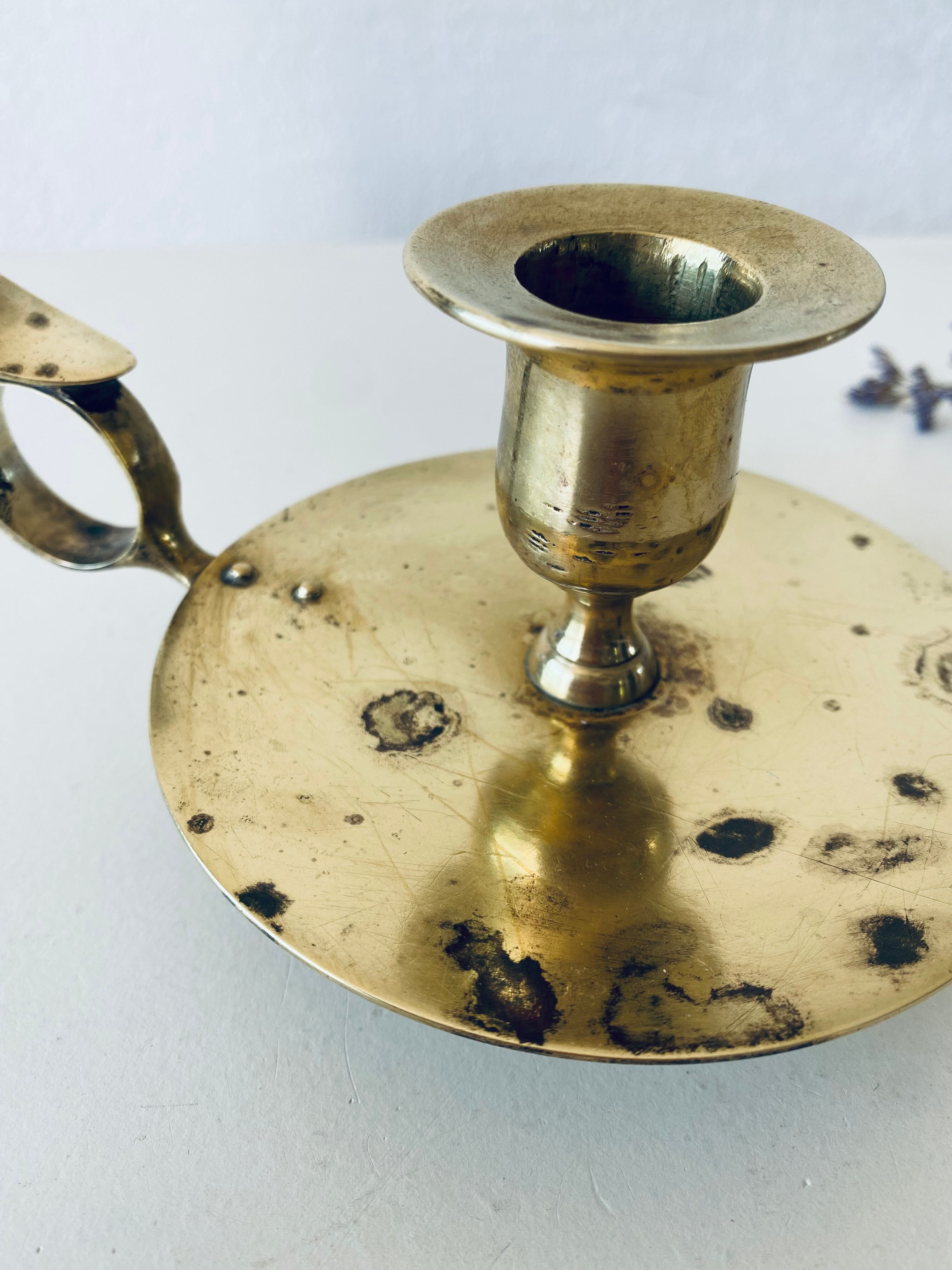 Old candle holder with handle