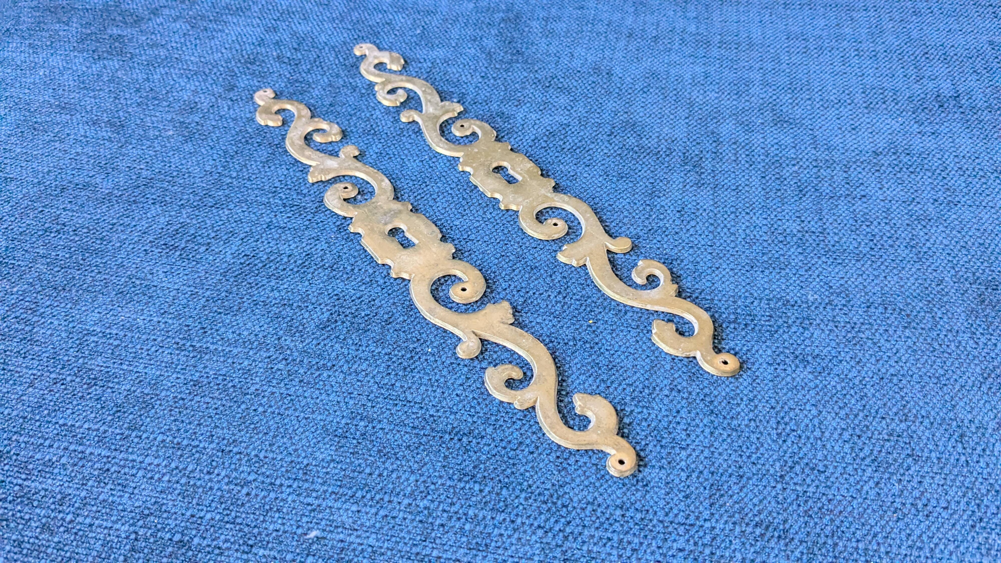 Pair of brass keyholes