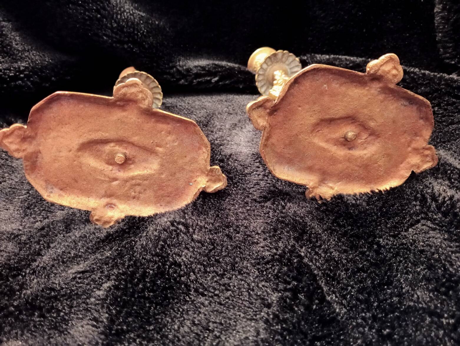 Pair of bronze candle holders decorated with herons