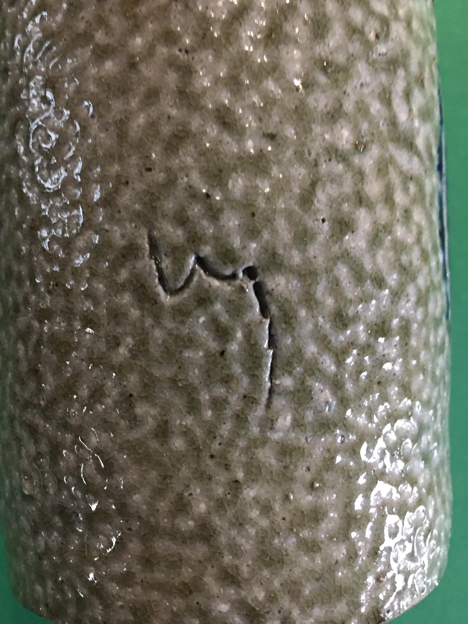 Sandstone scroll vase signed Jean Claude Monange, daisy motif