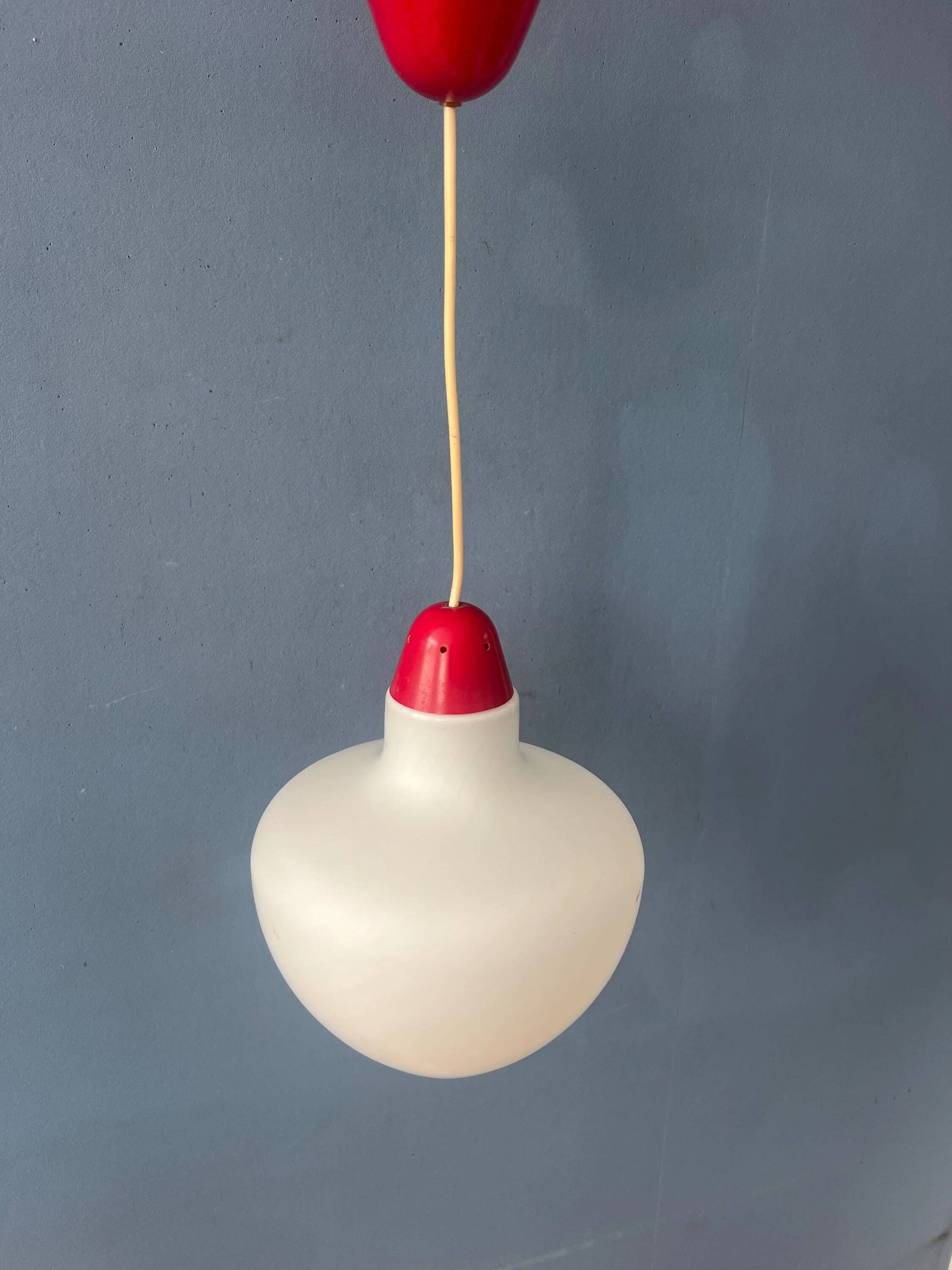 Mid-Century opaline glass suspension with a red upper part and ceiling cover.