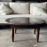 Coffee table, round antique Indonesian teak table with straight legs.