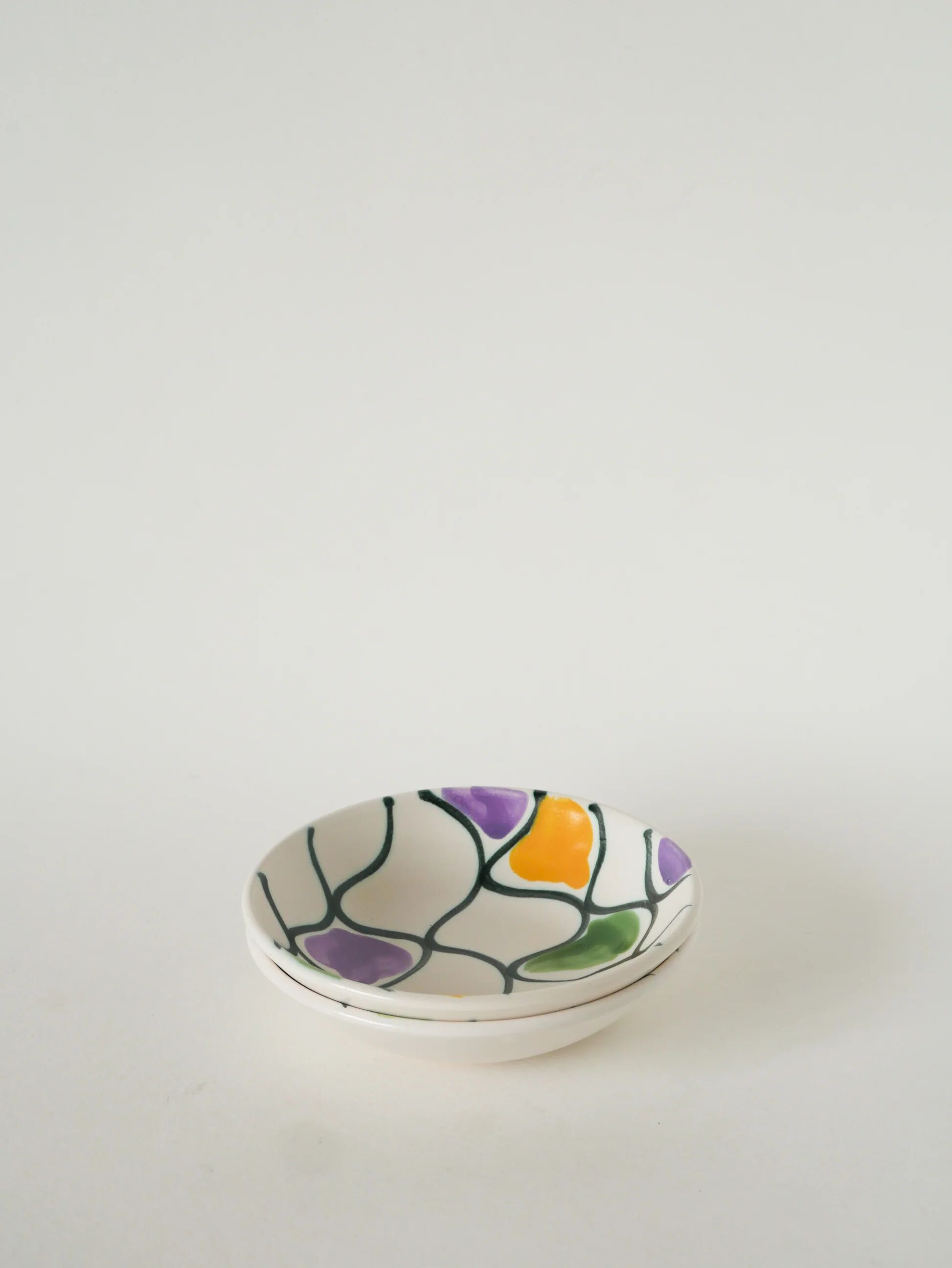 Pair of ceramic ramekins, abstract patterns in yellow, purple, and green, Pornic model, 1960.