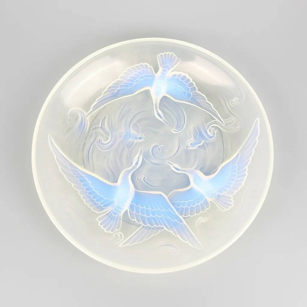 Verlys, iridescent glass cut with a design of geese and fish.