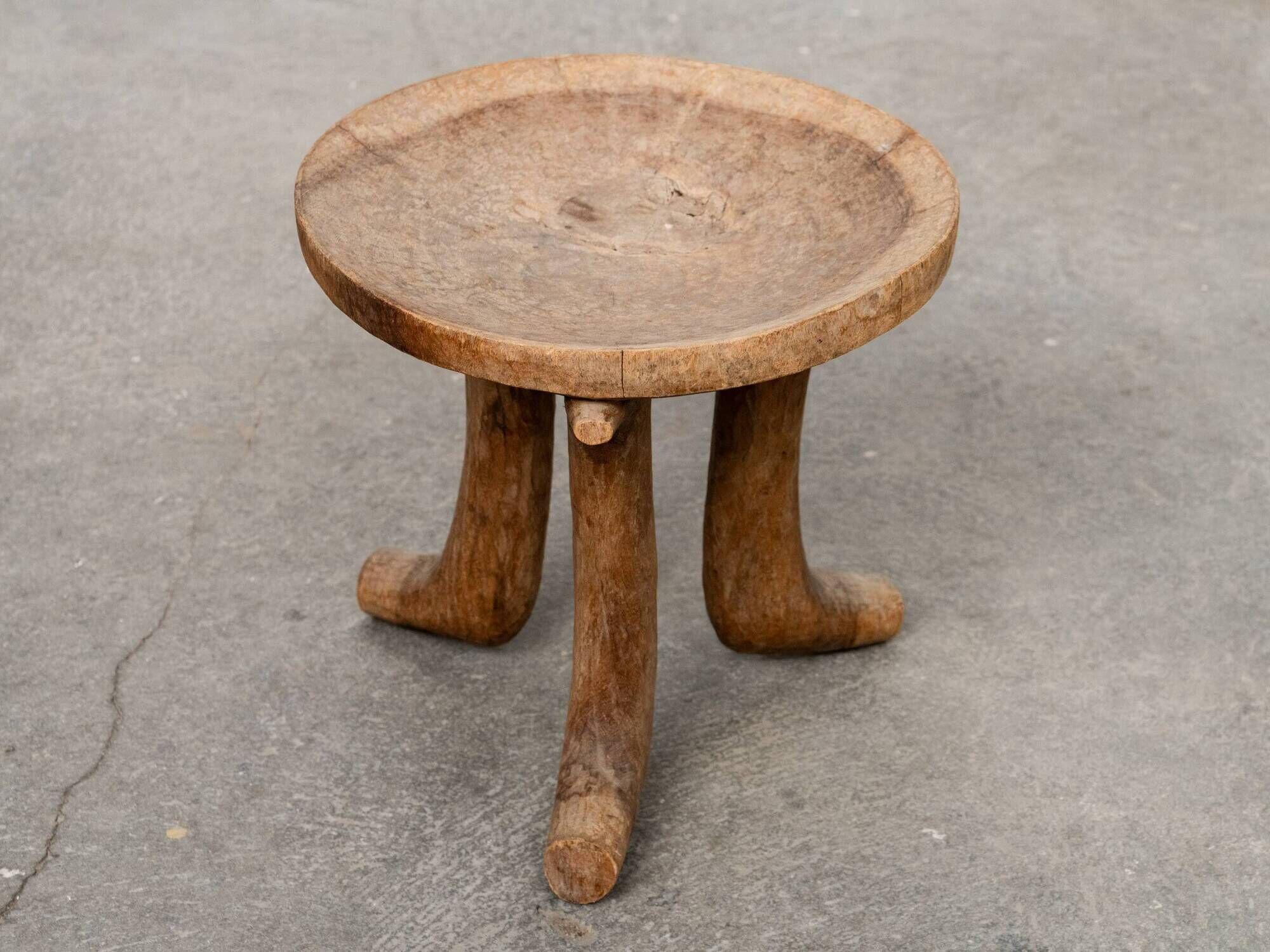 Ancient primitive monoxyle tripod stool from Ethiopia, Wanza wood.