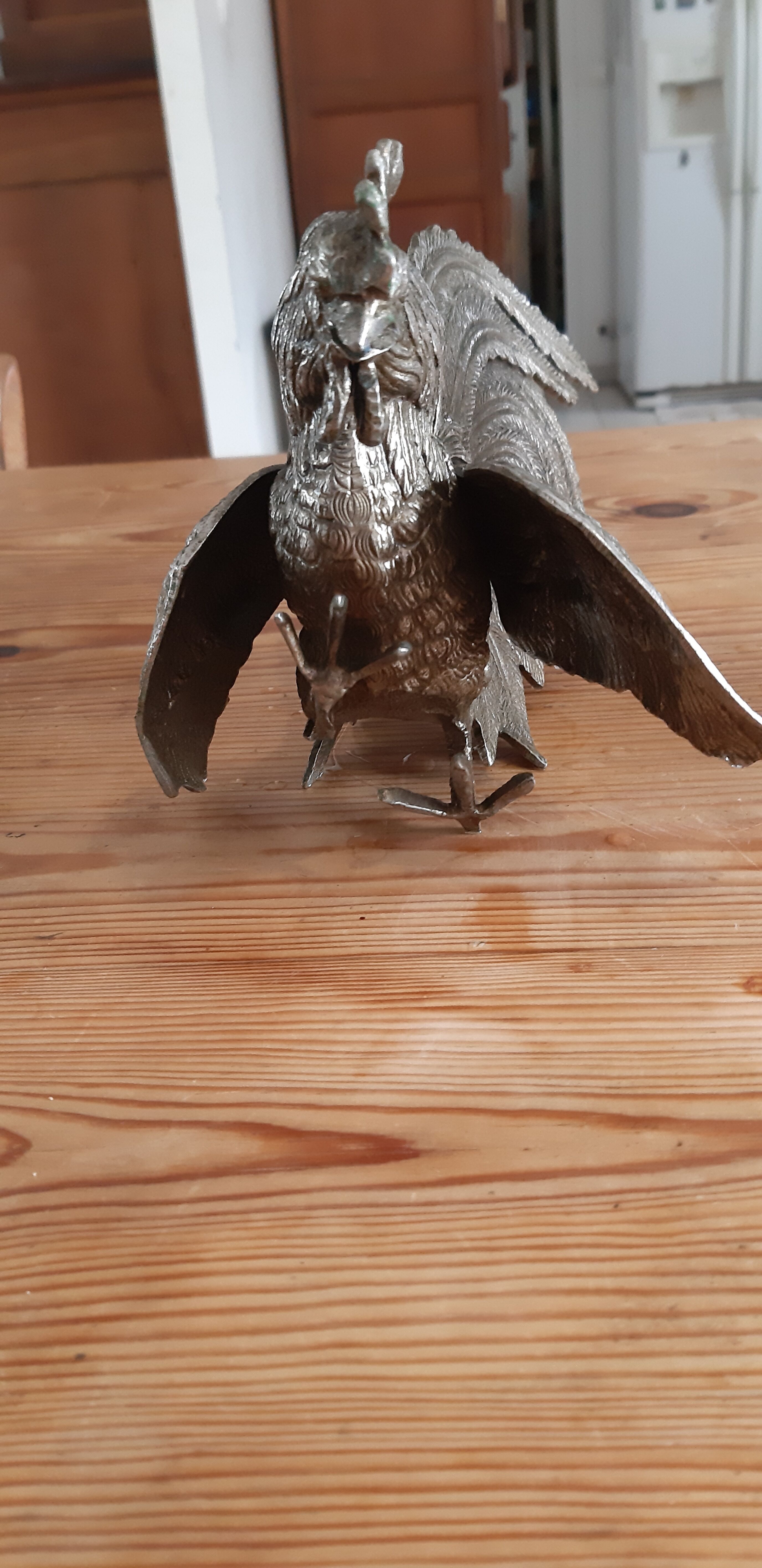 2 silver metal roosters