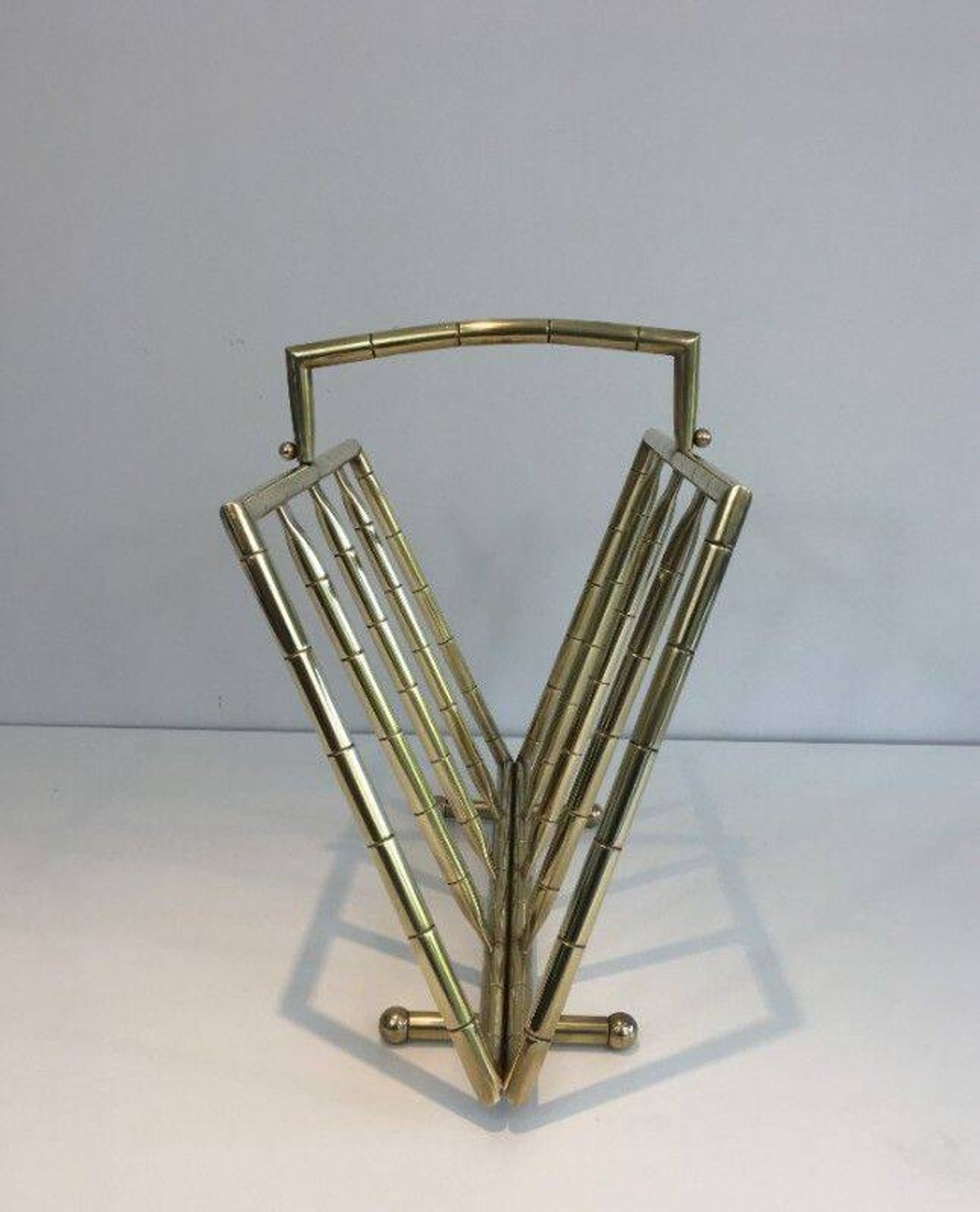 Brass faux-bamboo style magazine rack