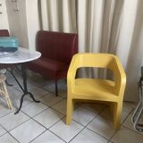 Orange-yellow designer armchair