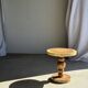 Coffee table in solid suar with central leg and spheres H56.5 D55.5