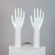 Pair of authentic vintage jewellery displays in industrial porcelain representing hands.