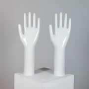Pair of authentic vintage jewellery displays in industrial porcelain representing hands.