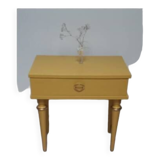 Old bedside table with compass feet